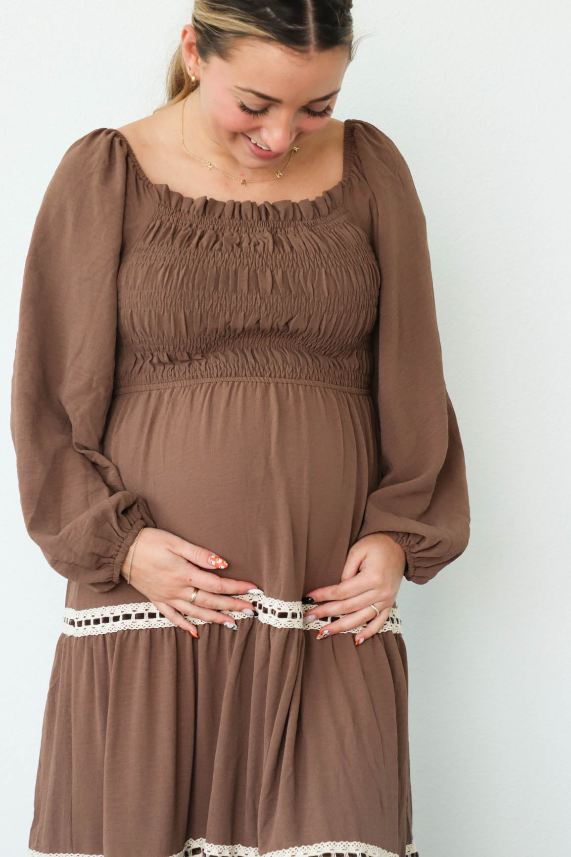 girl wearing long brown dress