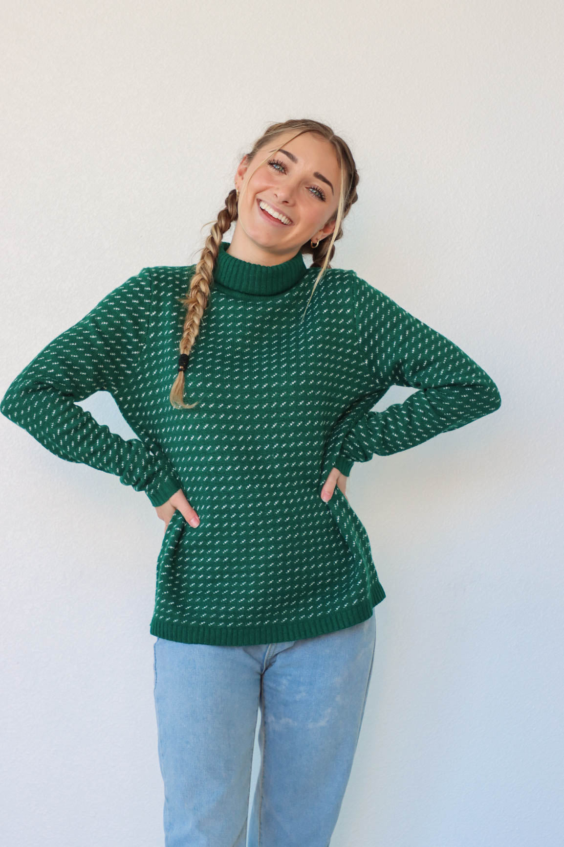 girl wearing green knit turtleneck sweater