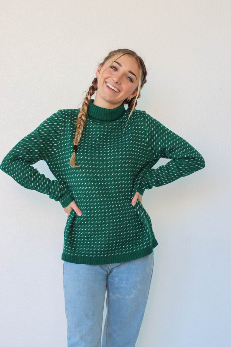 girl wearing green knit turtleneck sweater