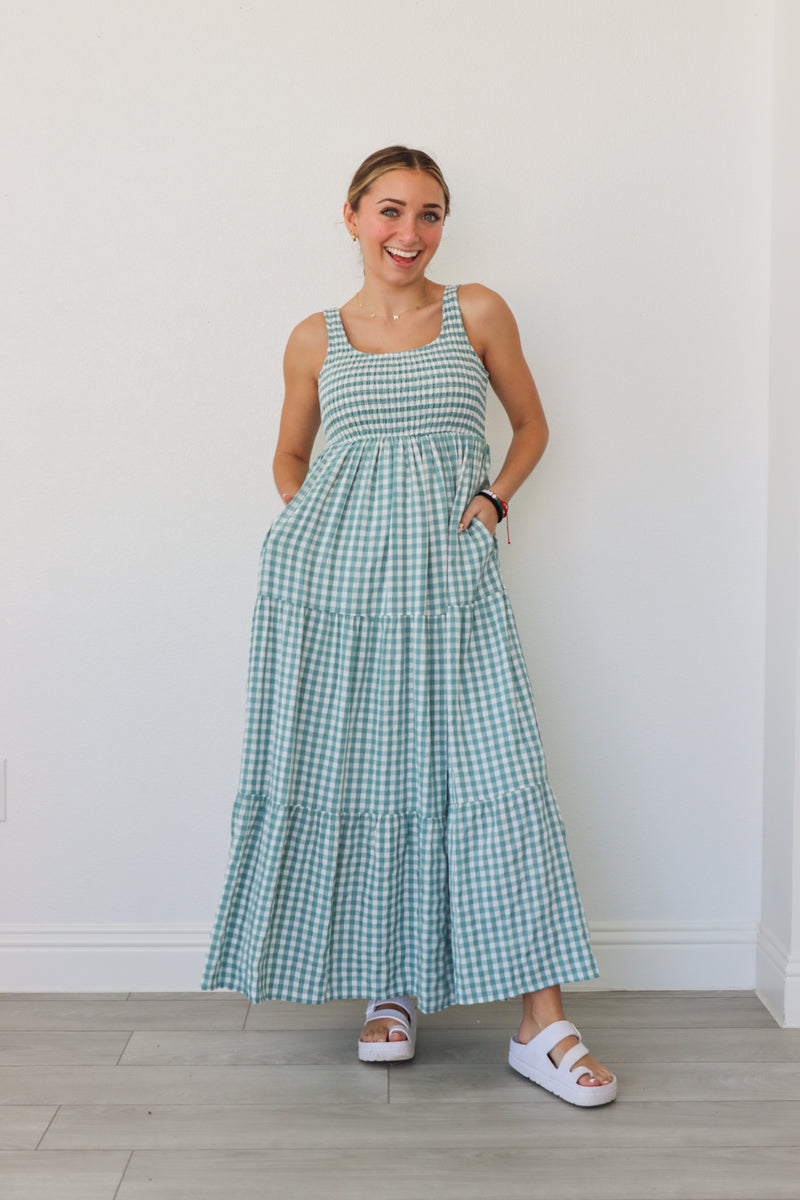 girl wearing blue gingham maxi dress