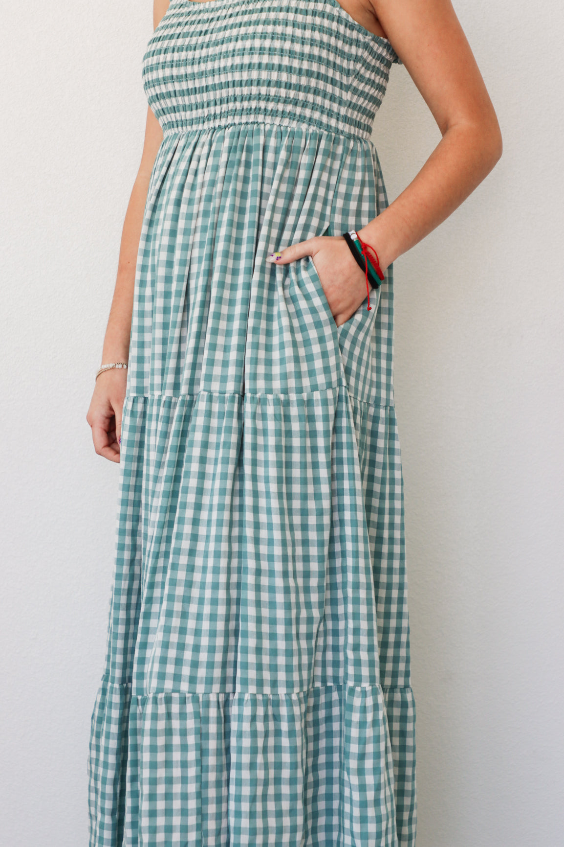 girl wearing blue gingham maxi dress