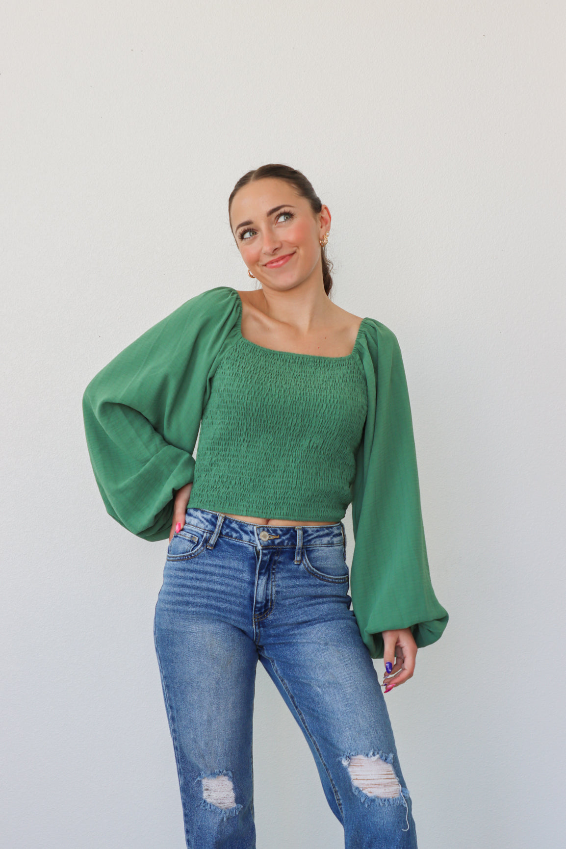 girl wearing green longsleeve top