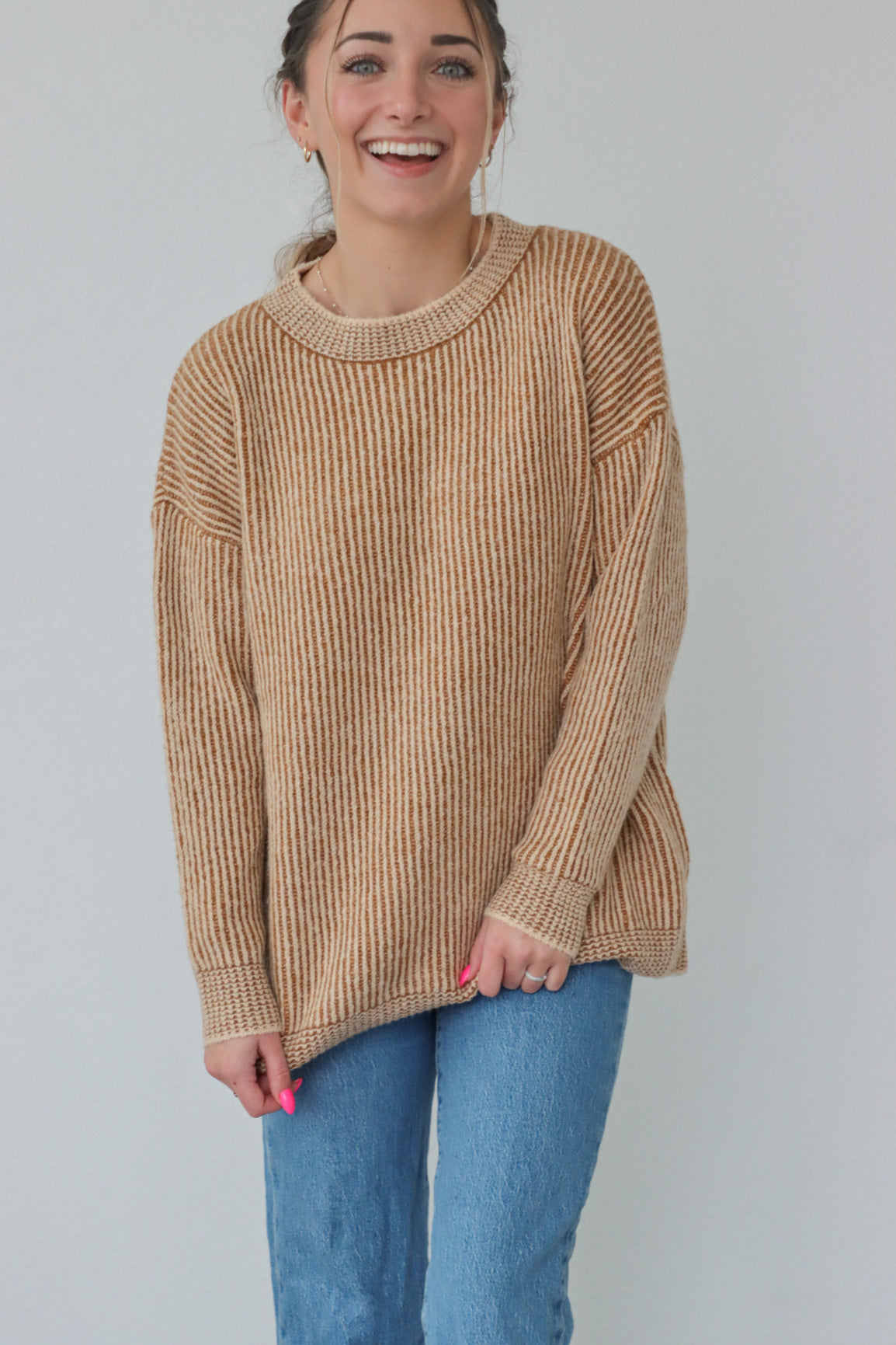 girl wearing tan ribbed sweater