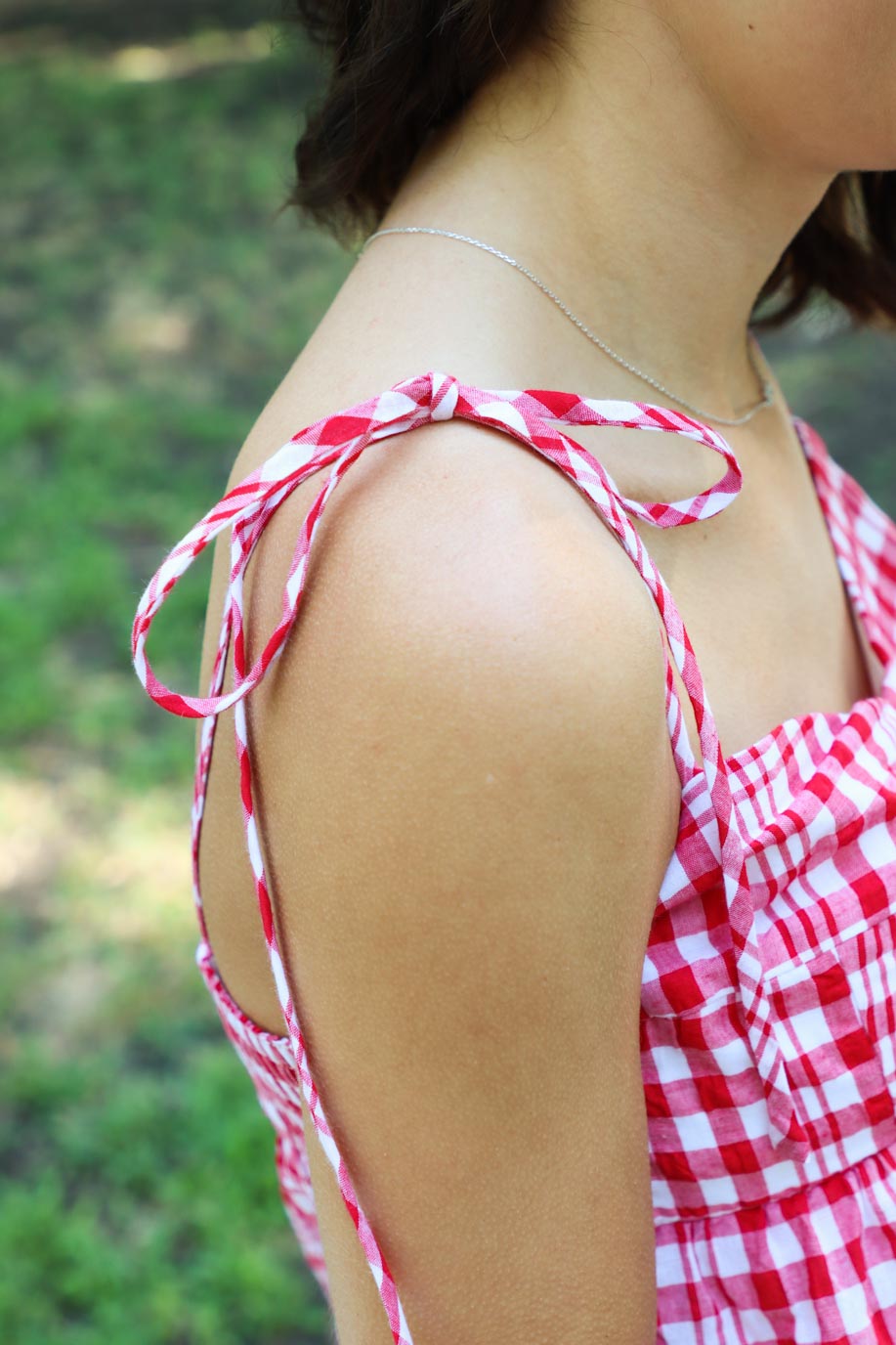 adjustable straps on red gingham tank top