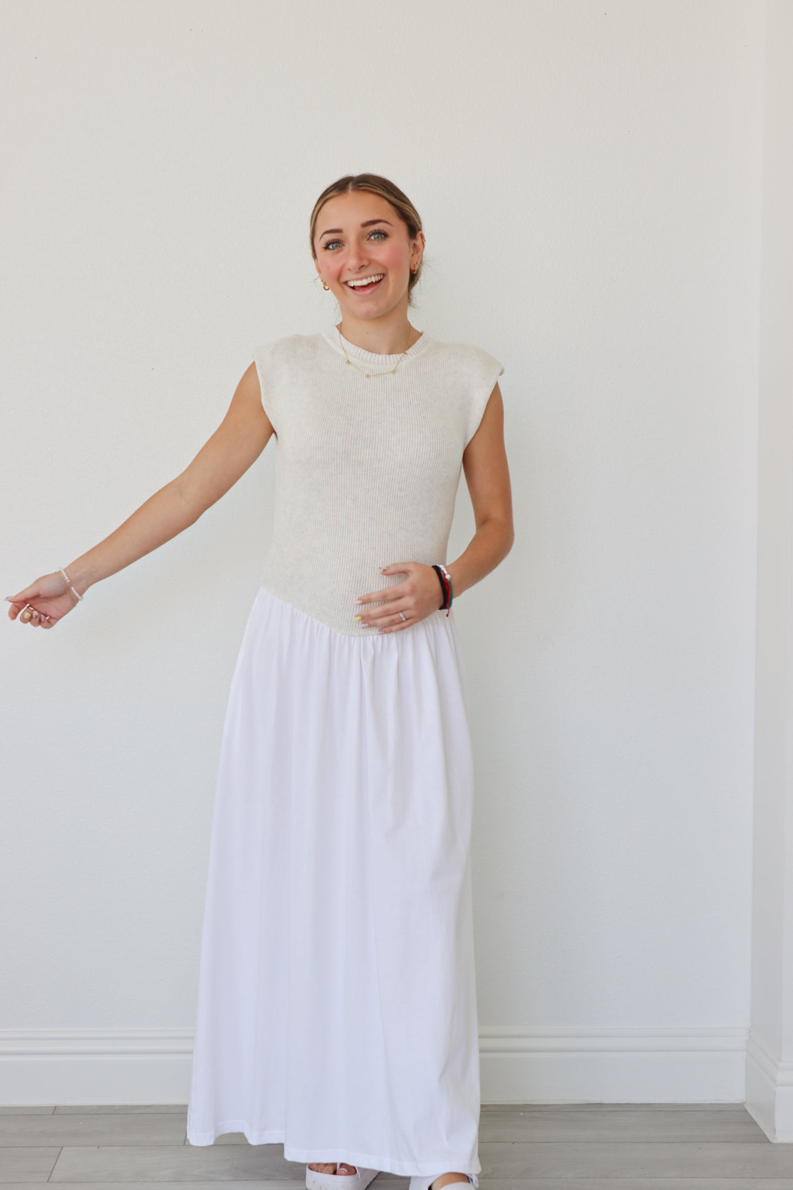 girl wearing cream and white long dress