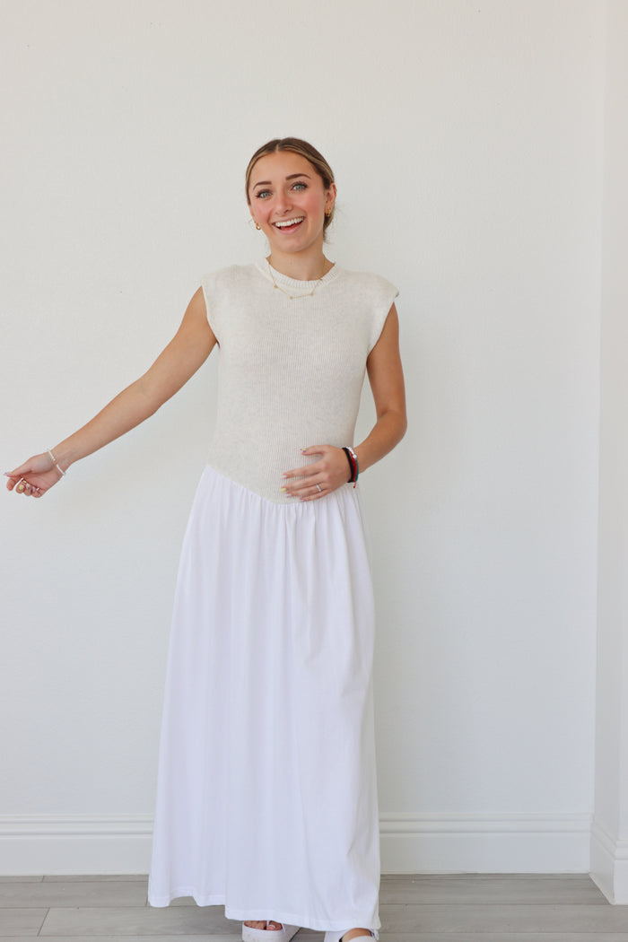 girl wearing cream and white long dress