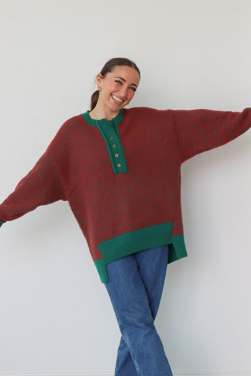 girl wearing red and green button down knit sweater