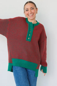 girl wearing red and green button down knit sweater