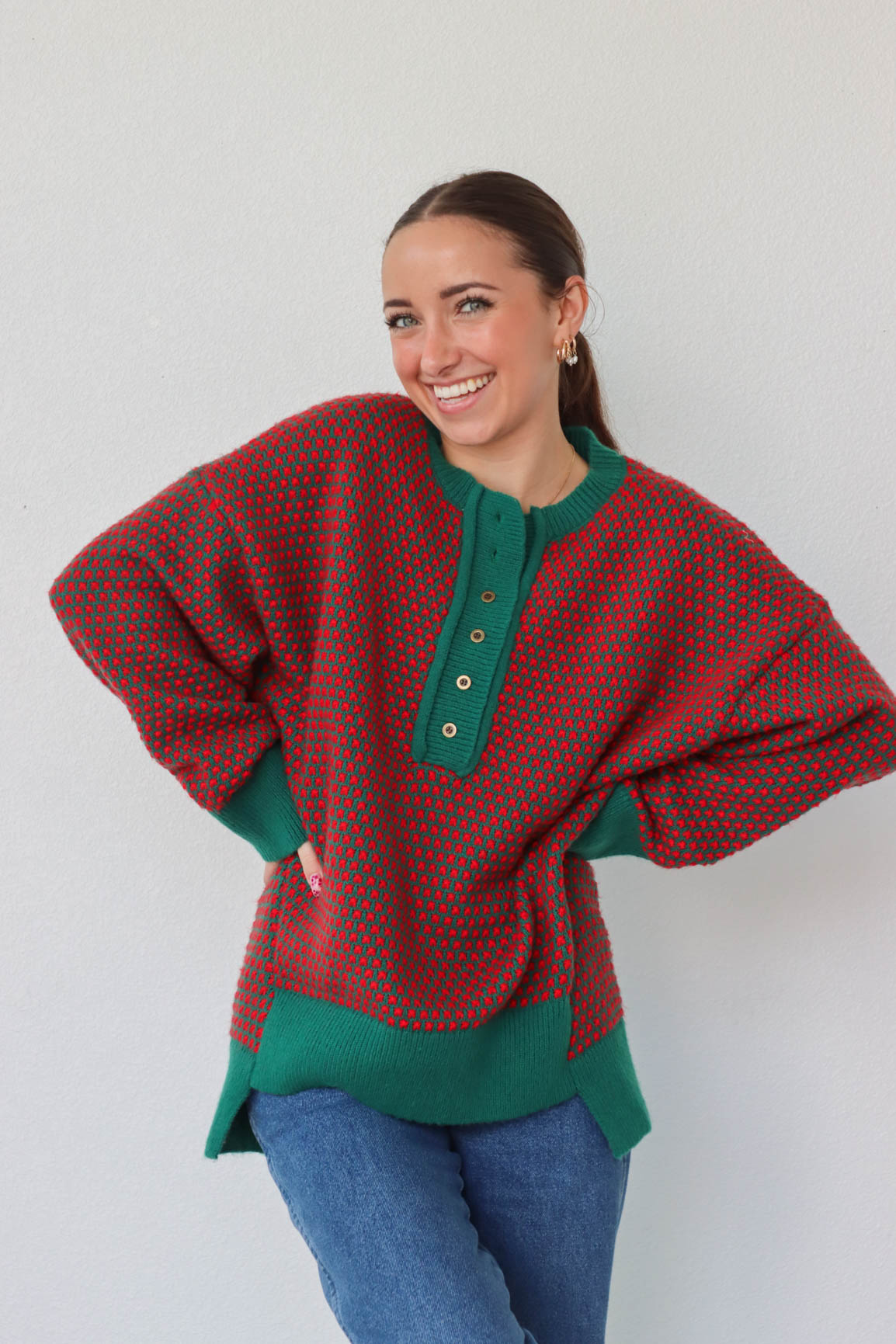 girl wearing red and green button down knit sweater