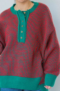 girl wearing red and green button down knit sweater