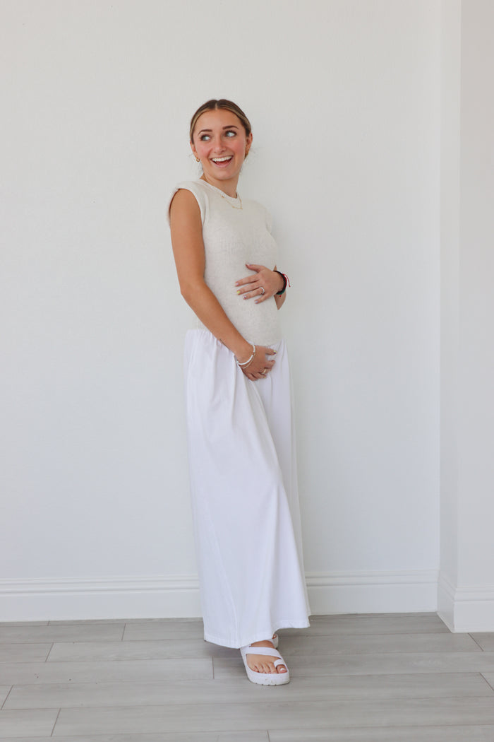 girl wearing cream and white long dress