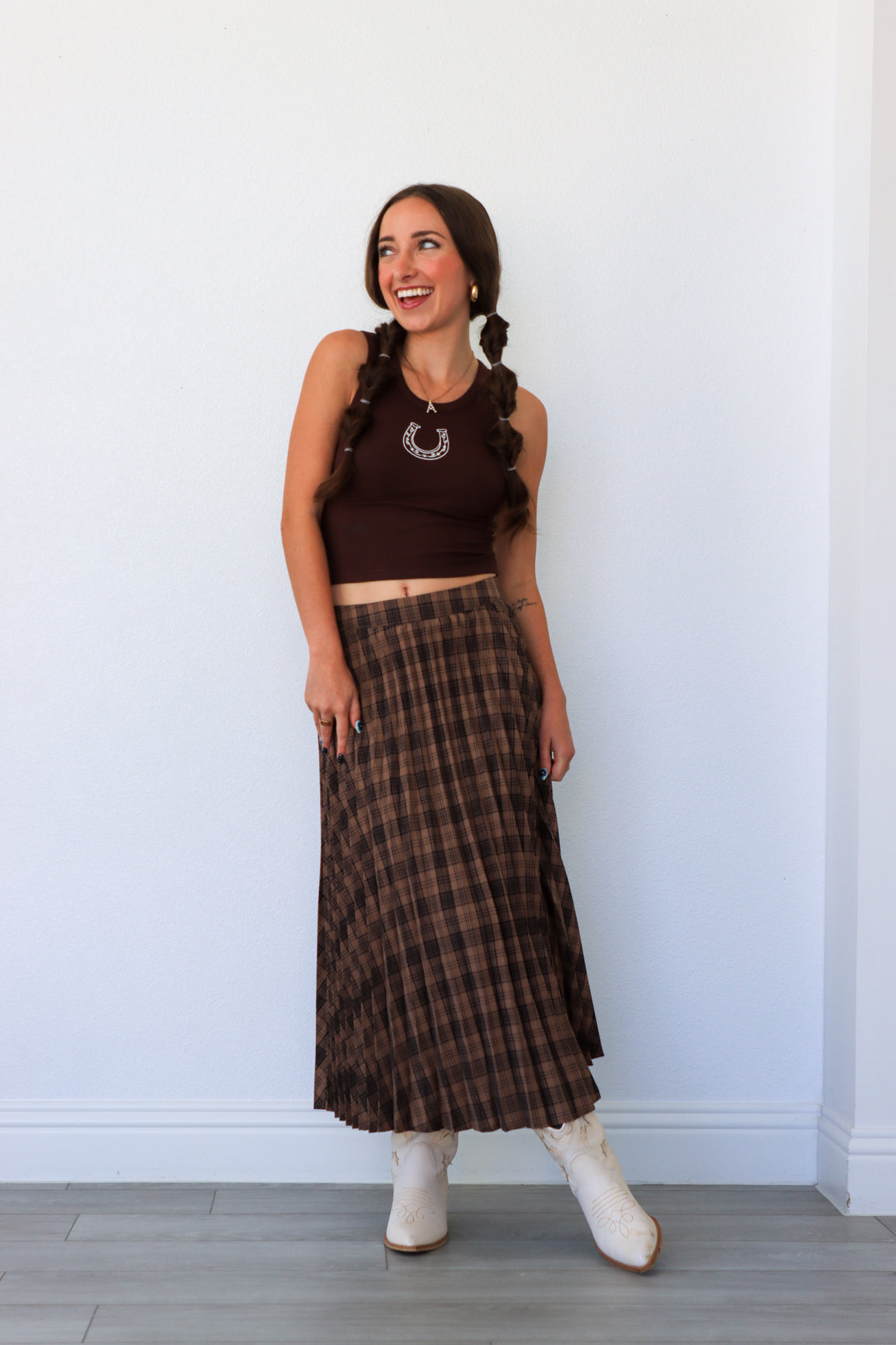 woman wearing dark brown plaid midi skirt
