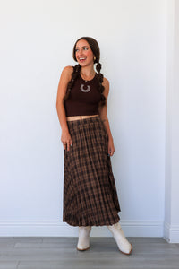 woman wearing dark brown plaid midi skirt