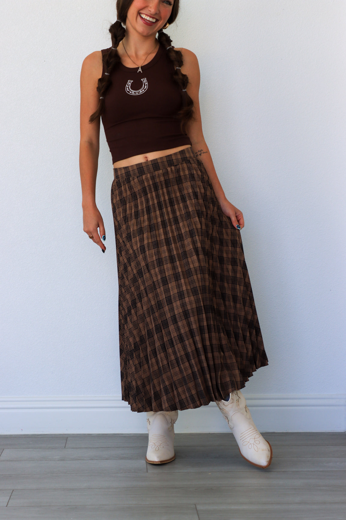 woman wearing dark brown plaid midi skirt
