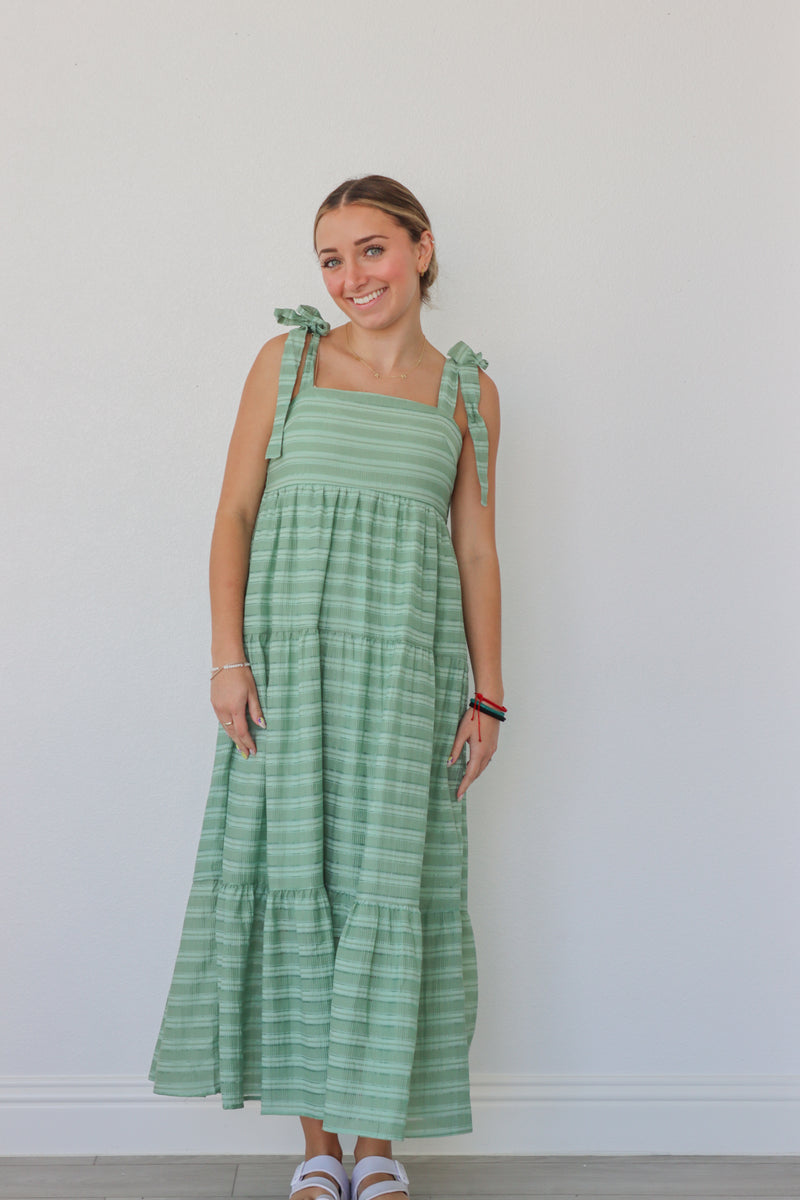 girl wearing green striped maxi dress