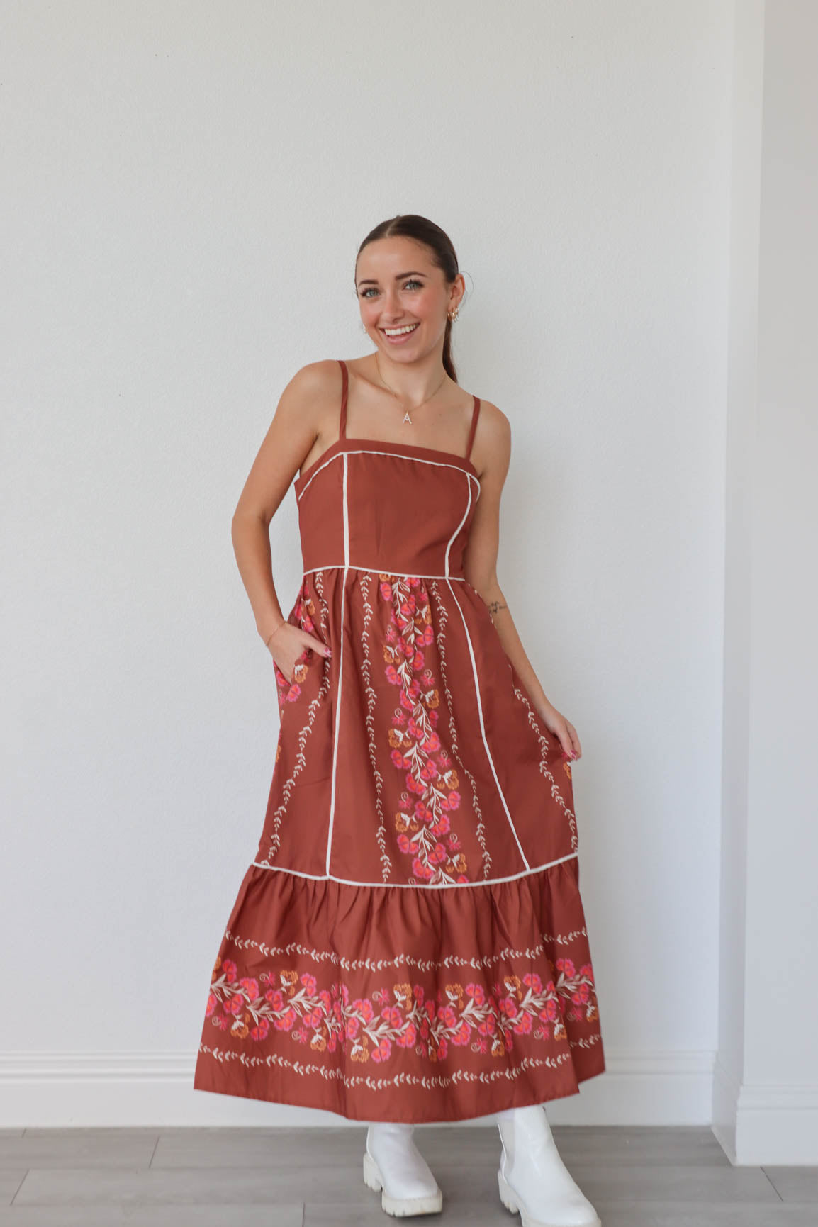 girl wearing dark orange maxi floral dress