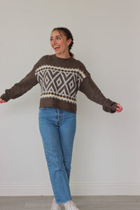 girl wearing brown knit sweater with light and cream detailing