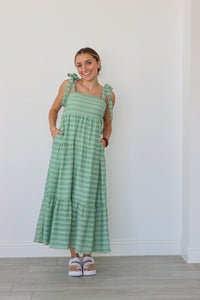 girl wearing green striped maxi dress