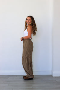 woman wearing brown pinstripe pants