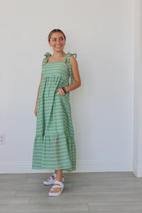 girl wearing green striped maxi dress