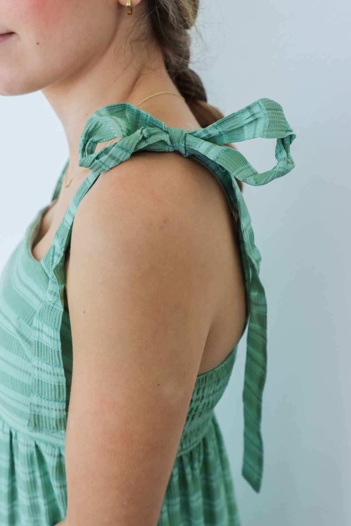 girl wearing green striped maxi dress