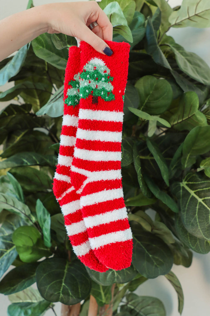 red fuzzy christmas socks with stripes and christmas tree design