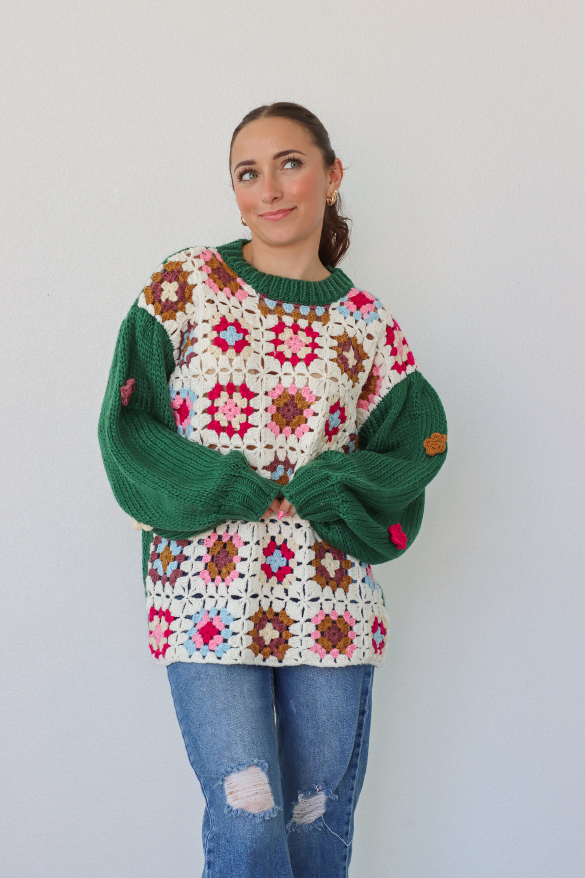 girl wearing green and cream crochet sweater