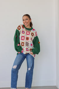 girl wearing green and cream crochet sweater