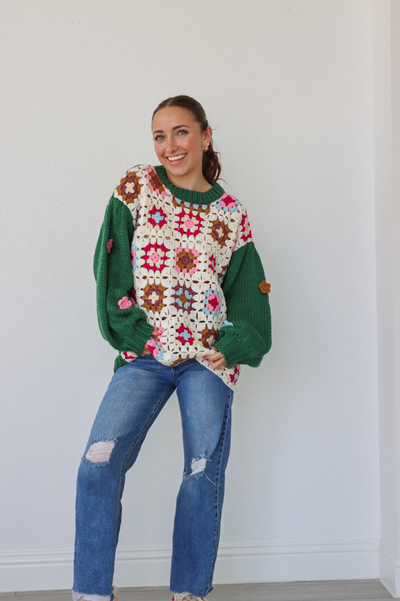 girl wearing green and cream crochet sweater