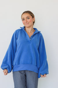 girl wearing royal blue fleece pullover