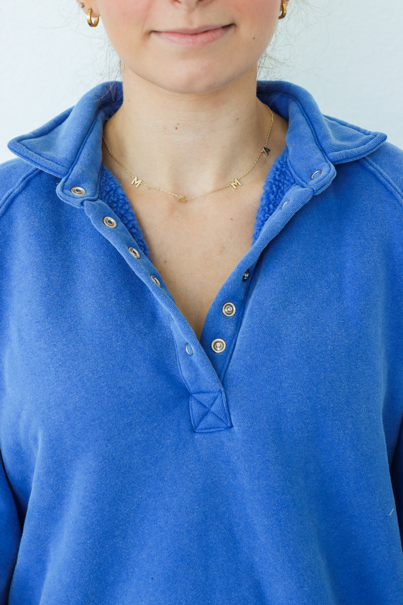 girl wearing royal blue fleece pullover