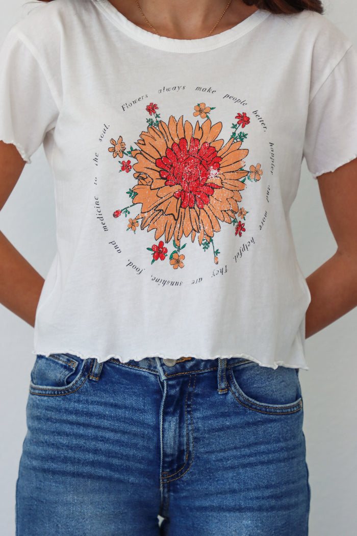 girl wearing white t-shirt with floral graphic