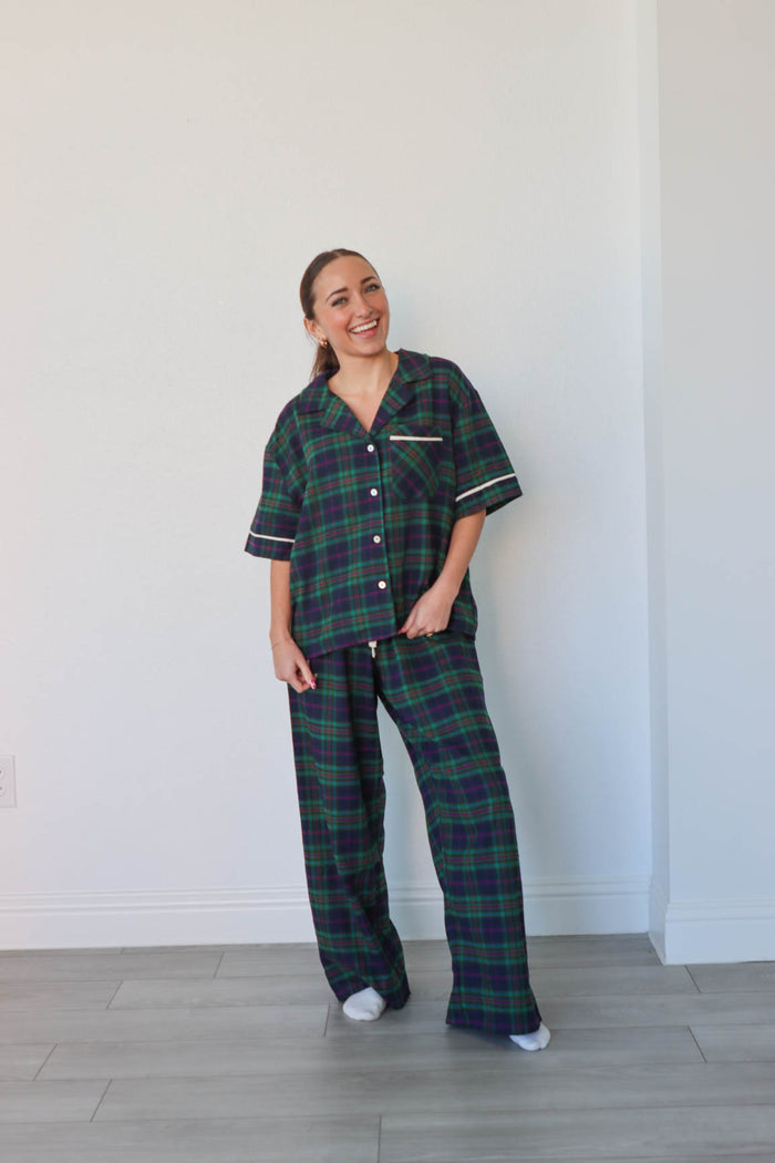 girl wearing dark green plaid pajamas