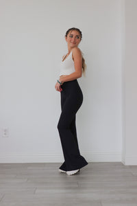 girl wearing black flare yoga pants