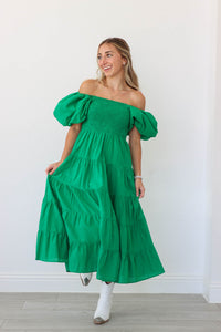 girl wearing long green dress with puff sleeves