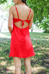 open back detailing on short red tank top dress with keyhole detailing