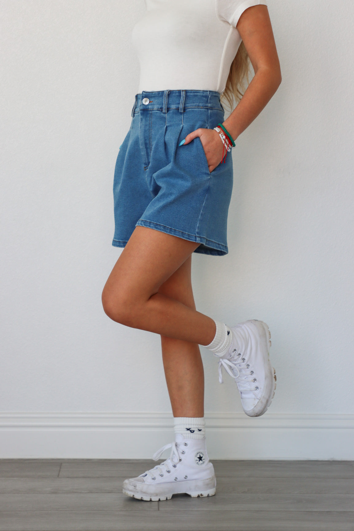 girl wearing blue denim jean shorts