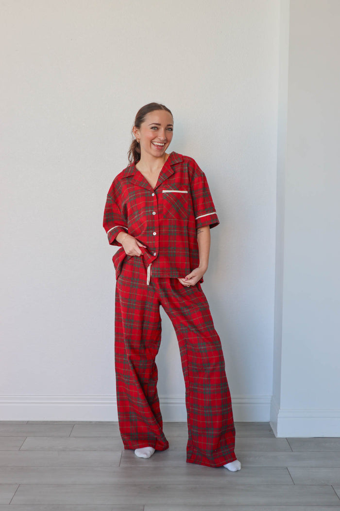 girl wearing red plaid pajamas