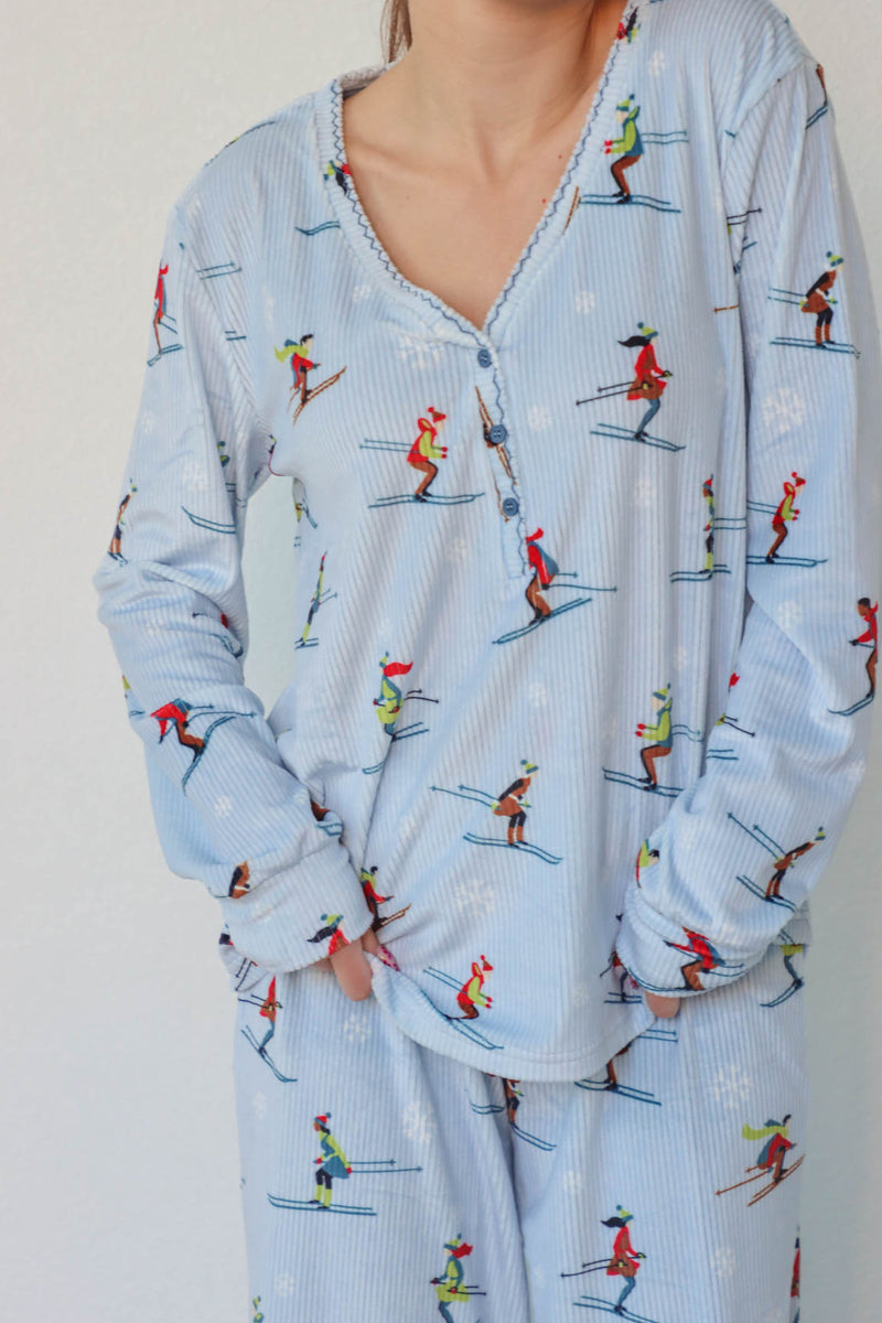 girl wearing light blue ski pajamas