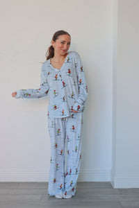 girl wearing light blue ski pajamas