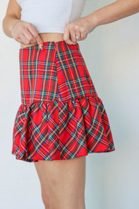 girl wearing red plaid skirt