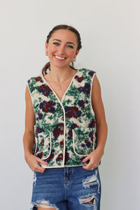 girl wearing fleece floral vest