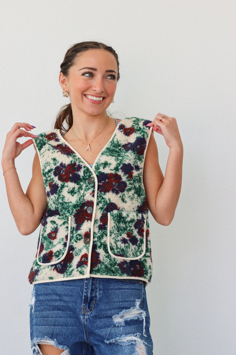 girl wearing fleece floral vest