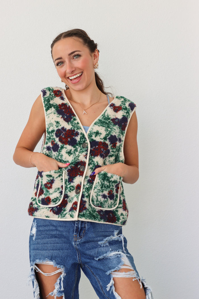 girl wearing fleece floral vest