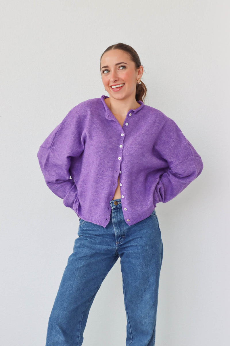 girl wearing purple cardigan