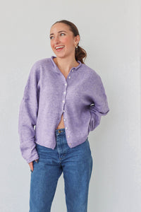 girl wearing light purple cardigan