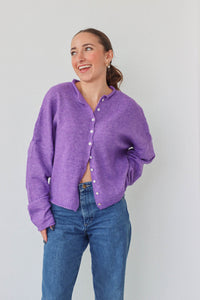 girl wearing purple cardigan