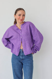 girl wearing purple cardigan