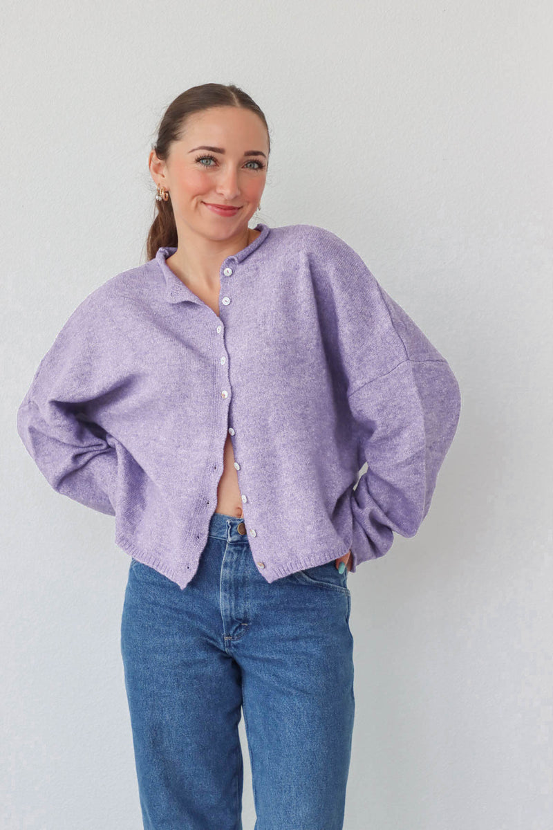 girl wearing light purple cardigan