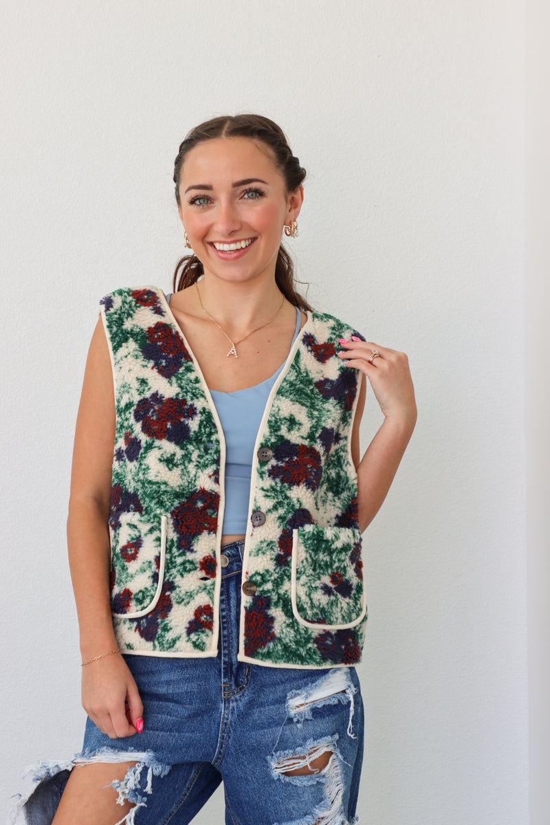 girl wearing fleece floral vest